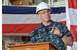 Capt. James A. Kirk, commanding officer of the future guided-missile destroyer USS Zumwalt , speaks to crew and guests in the hangar bay as part of the ship's turnover ceremony. (U.S. Navy photo by Roger S. Duncan)