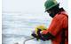 Jason Story, a project manager with the Coast Guard Research and Development Center, prepares to deploy a Coast Guard Marine Safety and Security Team remotely operated vehicle aboard the Coast Guard Cutter Healy. The ROV worked in tandem with other multi-agency unmanned and remote technologies in the first exercise of its kind to be held in the extreme conditions that frequent the Arctic Ocean. (U.S Coast Guard photo by Petty Officer 3rd Class Grant DeVuyst)