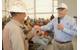 Johnny Conrad, Conrad Chairman and CEO, hands Johnny Kinkle the keys to his new boat. (Photo: Conrad Shipyard)