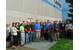 Joined by Jet Edge employees and local business and government leaders, Jet Edge President Jude Lague cuts a ribbon to mark Jet Edge’s 30th anniversary in the waterjet industry. The ribbon cutting was coordinated by the I-94 West Chamber of Commerce.  Photo courtesy I-94 West Chamber of Commerce.