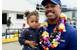 Lt. j.g. Joshua Martin, executive officer, Coast Guard Cutter Joseph Gerczak, holds his daughter following the cutter's arrival Honolulu on February 4, 2018 (USCG photo by Sara Muir)