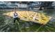 MARIN's Olaf Waals pictured with the scale model of a mega floating island in its Offshore Basin in a storm of waves, wind and currents. (Images: MARIN)