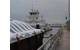 M/V New Dawn, pushing nine barges, marks the unofficial start to the navigation season for the Upper Mississippi River. (Photo by Pamela Niebur)