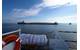 Roger Blough sits grounded in the vicinity of Gros Cap Reefs Light in Whitefish Bay, Lake Superior, May 29, 2016, as seen from the deck of Coast Guard Cutter Mobile Bay. (U.S. Coast Guard photo courtesy Coast Guard Cutter Mobile Bay)