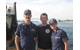 The RDC project team poses on USCGC Hollyhock after completion of the offshore mitigation system prototype test.  From left to right, LT Charles Clark, Alexander Balsley, and Coast Guard Academy Cadet 2/c Valerie Hines.)