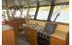 The utilitarian galley is also in the wheelhouse along with a mess table and two bunks