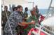 Timor-Leste Defense Force (F-FDTL) members try out HMAS Diamantina's firing fighting equipment during the Minehunter's visit to Timor Leste. (Photo: Ben Catterall)