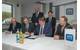 Volker Asmus, Managing Director MV WERFTEN Fertigmodule; Jarmo Laakso, Managing Director MV WERFTEN; Guido Kras, Owner Pari Group AG; and Johannes Gößler, Managing Director MV WERFTEN Fertigmodule, during the signing of the takeover contract. In the back: Economics Minister Harry Glawe and Genting Chief Executive Colin Au. (Photo: MV WERFTEN)